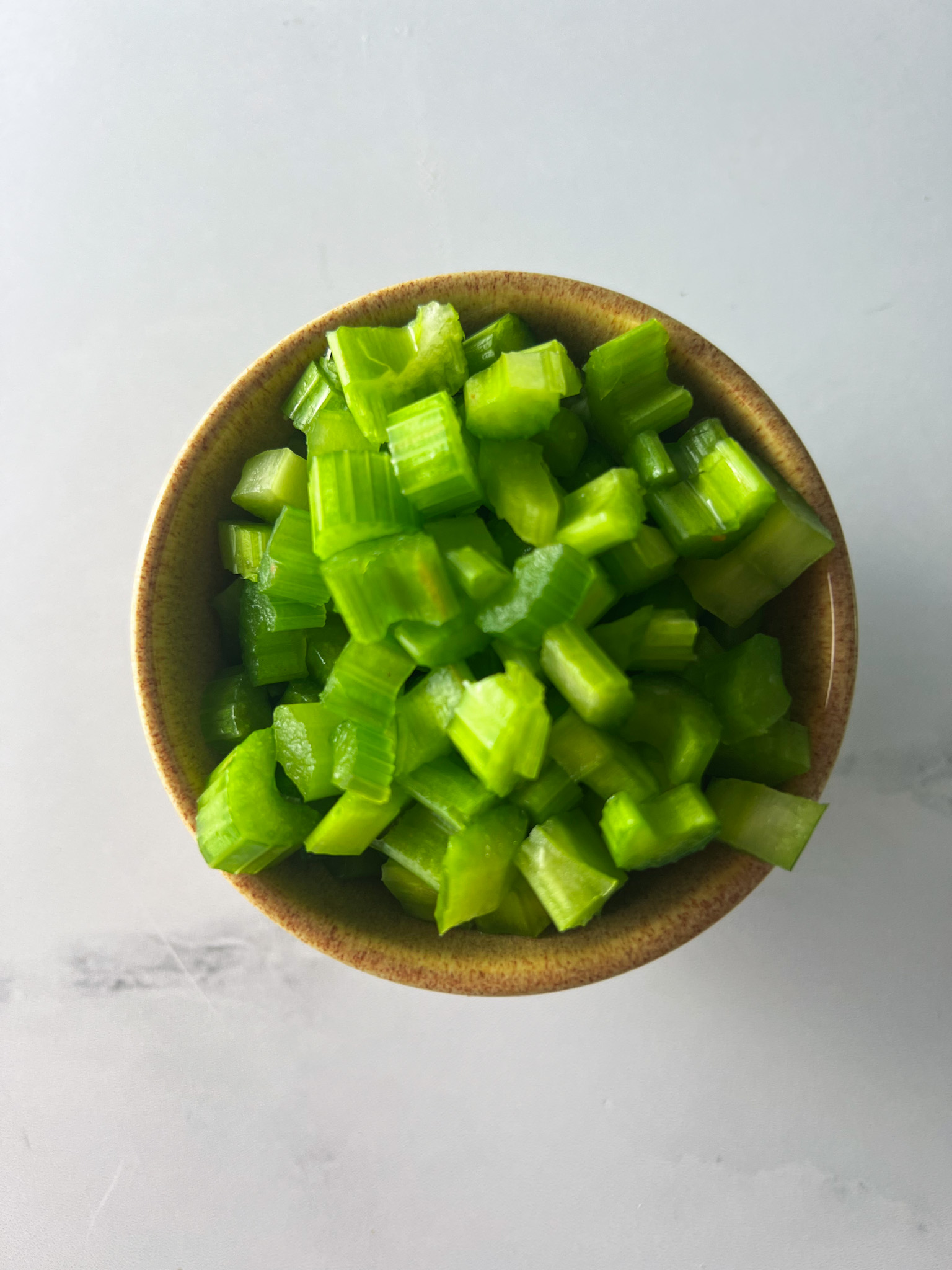 https://www.theperksofbeingus.com/panera-10-vegetable-soup/chopped-celery-in-a-bowl/