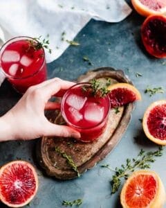 hand holding blood orange cocktail