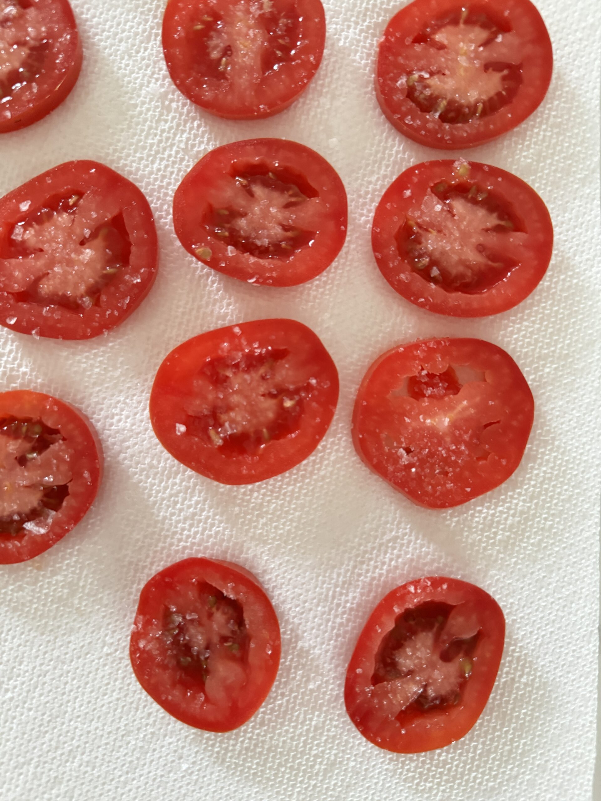 roma tomatoes on a paper towel