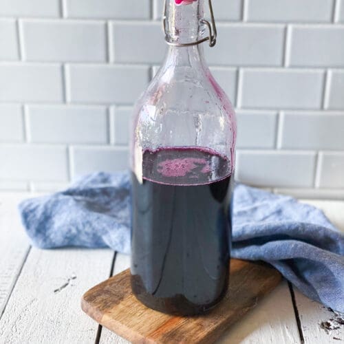 Blueberry simple surup in a large bottle