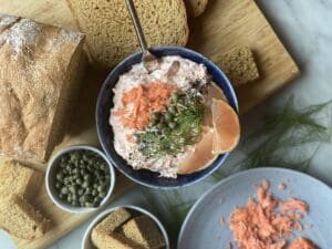 Smoked salmon spread with pink lemons and capers and bread
