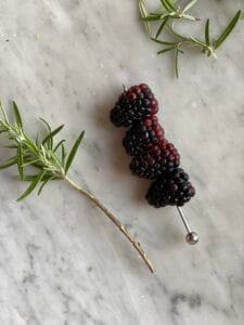 rosemary twig with blackberries