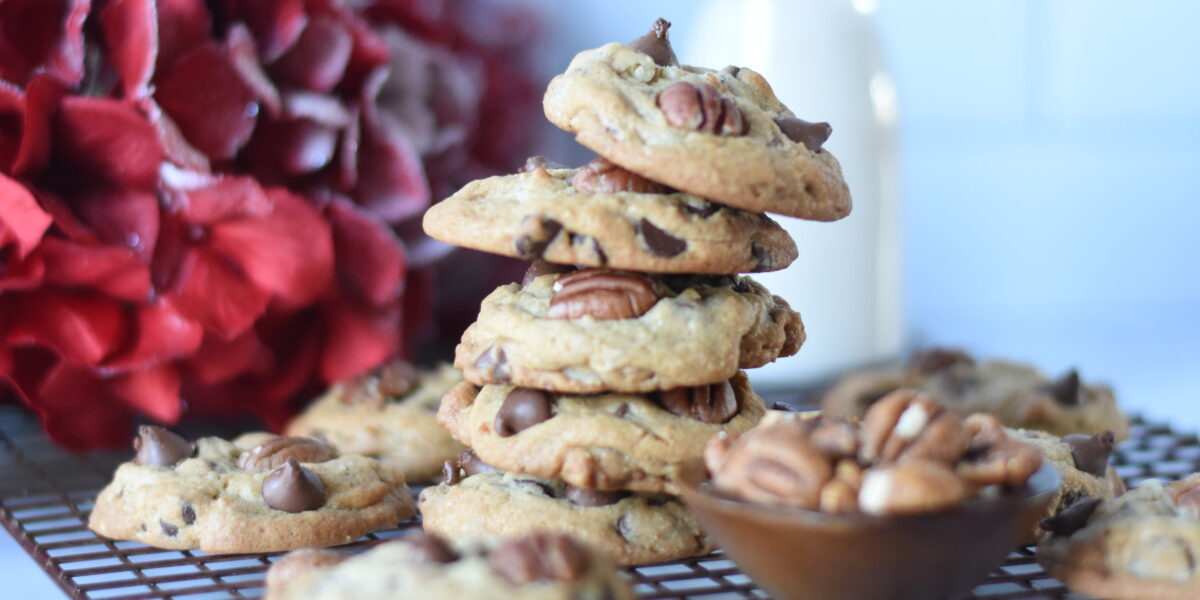 a stack of pecan chocolate chip cookies