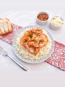 Valentine Dinner of 6 spiced shrimp over risotto with toasted bread, chili flakes and shaved parmesan