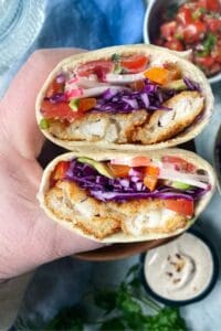 baja burrito in half in a hand