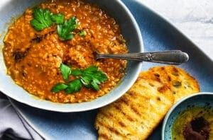red lentil soup with parsley, grilled sourdough and toasted Aleppo pepper olive oil.