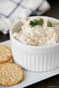ham dip in a ramekin with crackers