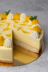 mango mouse cake with a slice out of it