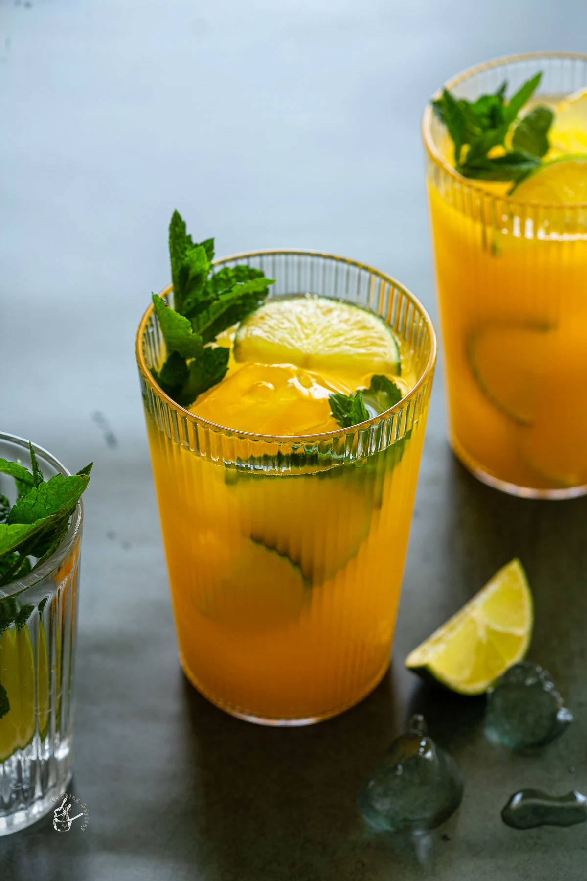 2 mango mocktails with mint and lime