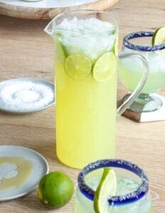 Pitcher of margaritas with 2 margaritas
