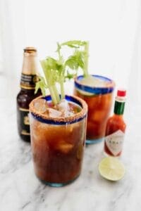 michalada in 2 glasses with a beer and tobasco