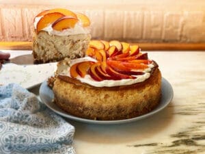 Peach cheesecake with a slice taken out