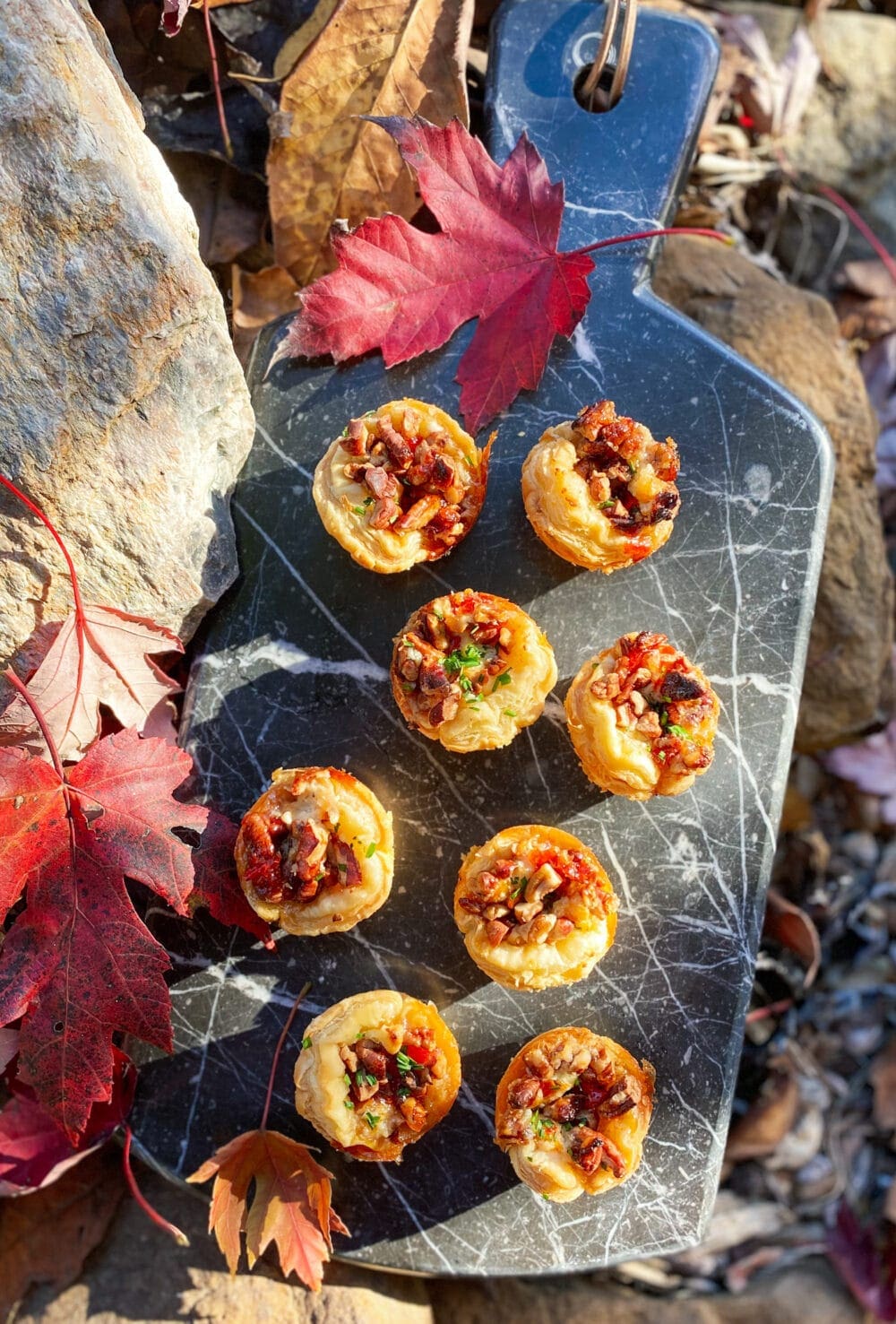 pecan and boursin tarts on a marble tray