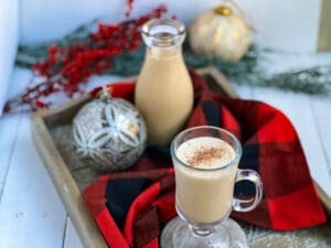 gingerbread eggnog in a bottle and I a mug with nutmeg, and ornaments
