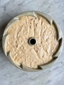 un-cooked butter pecan boutbon pound cake in a bundt pan