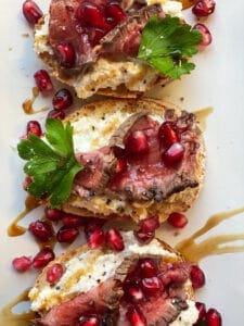 steak crostinis with ricotta and pomegranates