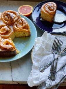 Cara Cara Orange rolls being served on a blue plate.