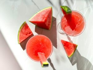 Watermelon martinis top down with wedges of watermelon