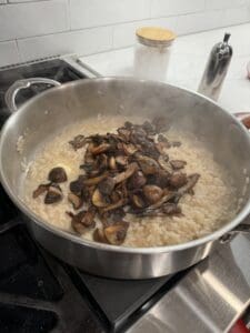 Sauteed mushrooms in a pan with risotto