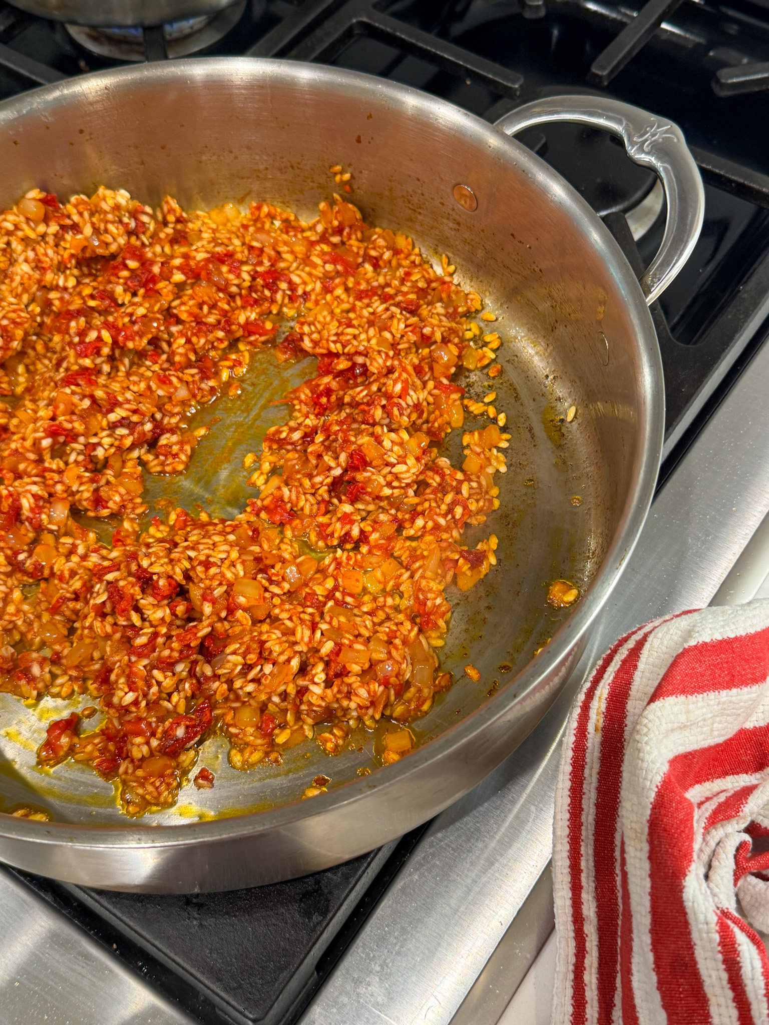 arbario rice and sundried tomatoes in a pan