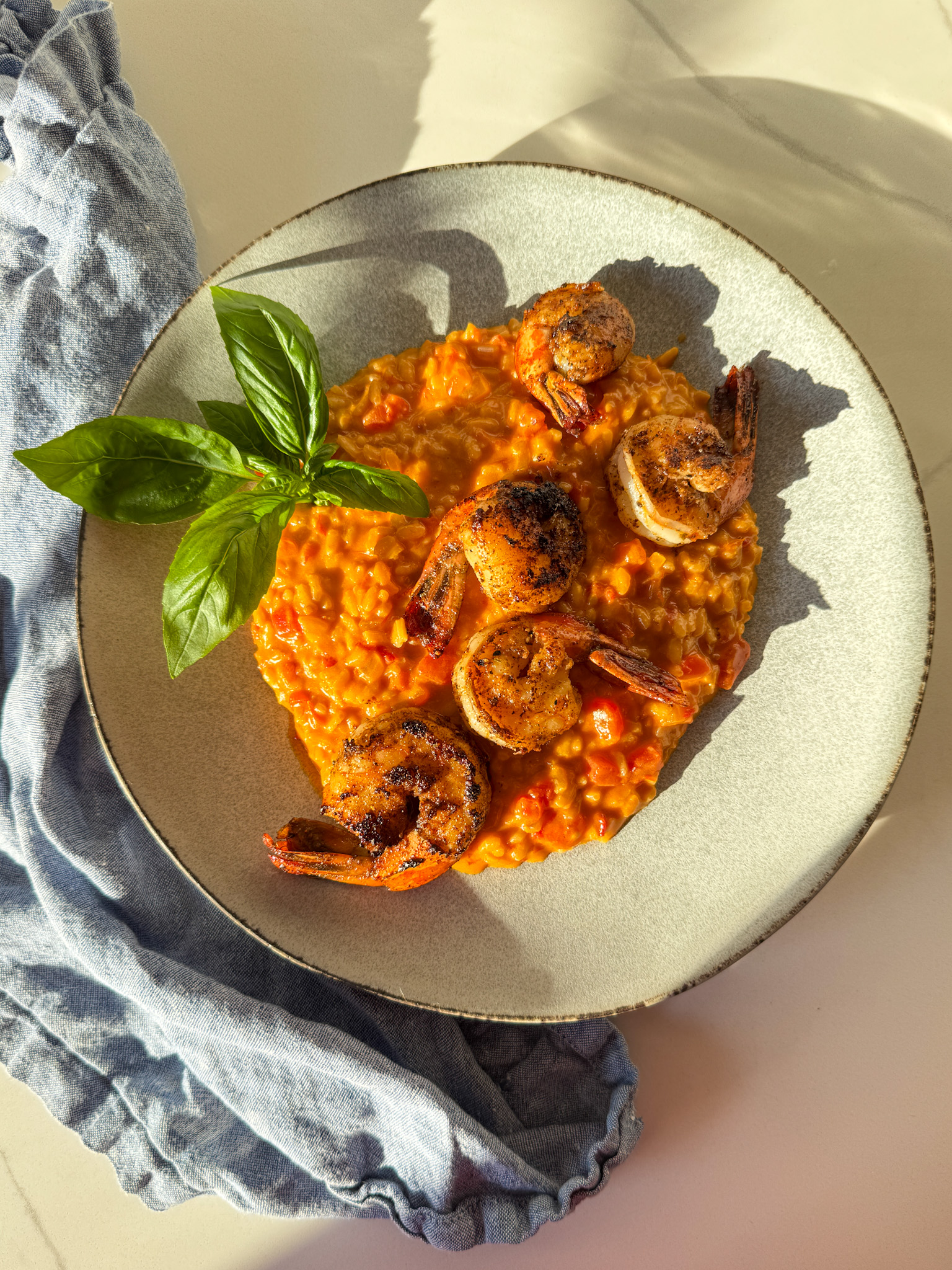 Tomato risotto with shrimp and basil