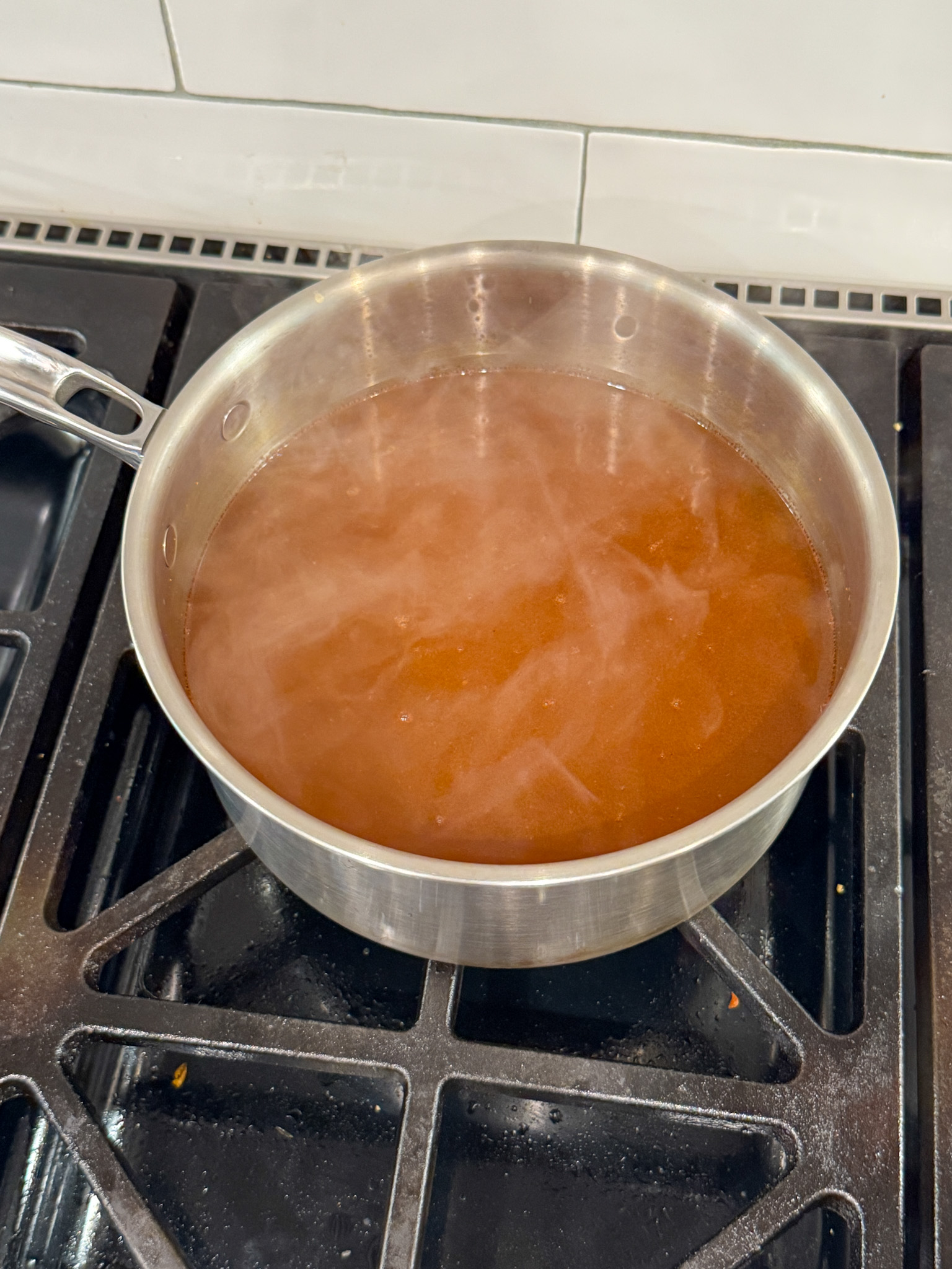 veggie broth with tomatoes in a pan