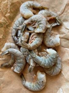 Raw shrimp in the shell on butcher paper