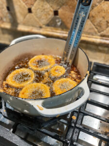 onion rings frying in oil