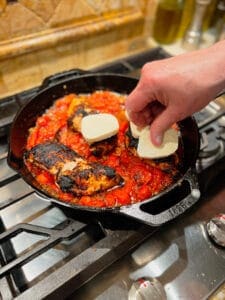 placing mozzarella on chic
