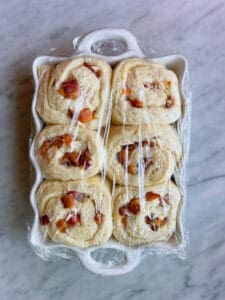 peach cobbler rolls with plastic wrap, raised