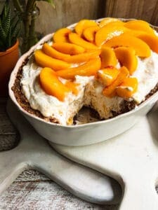peaches n cream dessert with a piece removed