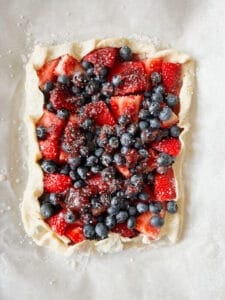 unbaked vegan fruit tart with blueberries and strawberries