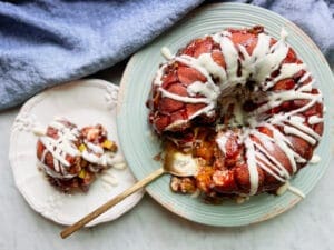 Apple monkey bread with a serving and a blue napkin