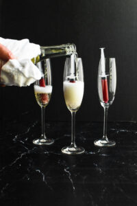 Prosecco being poured into vampire shots