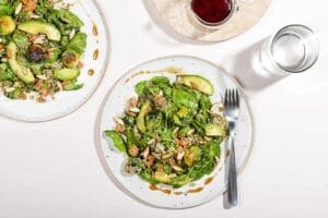 brussel sprouts salad on a plate with a fork