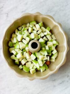 apples layered over biscuits to make apple monkey bread