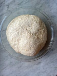 German pretzel buns dough that has raised