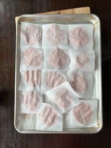 Ground Turkey Burgers smashed with parchment sheets