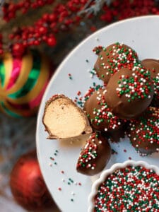 peanut butter balls with one cut in half and sprinkles