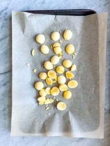cooked egg yolks on parchment paper
