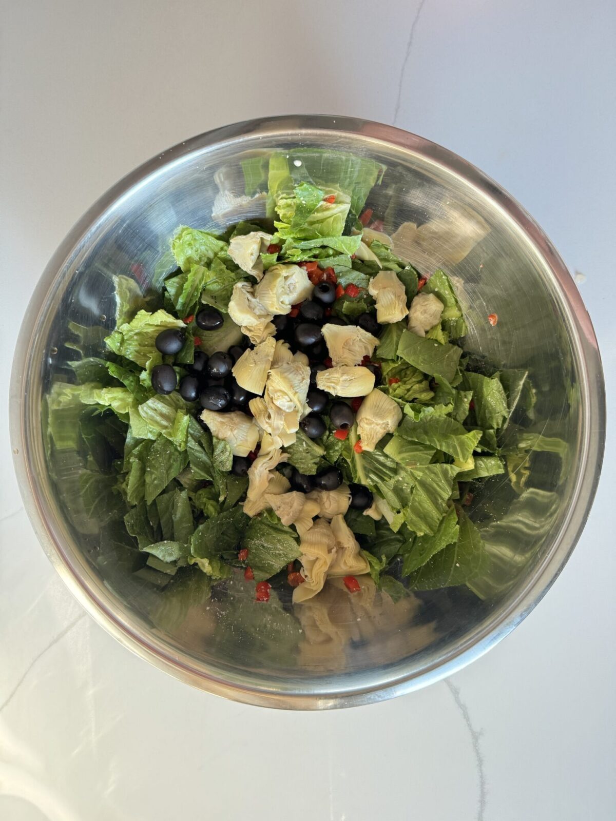 pasta house salad ingredients in a bowl