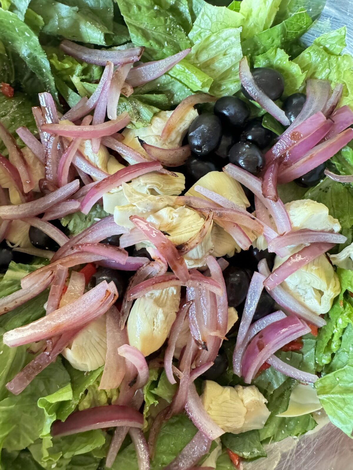 Sautéed onions on top of salad.