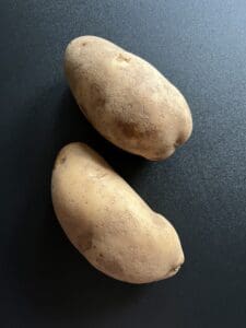 2 brown skinned potatoes