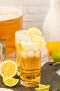 Beer cocktsil with lemon and ice in glass