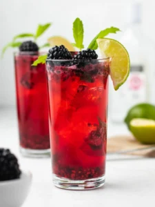 2 blackberry mojitos with lime and mint