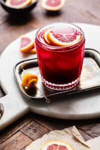 Seabreeze cocktail on a tray with grapefruit garnish