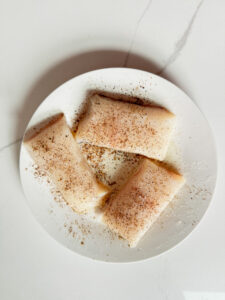 3 pieces of raw halibut with salt and pepper