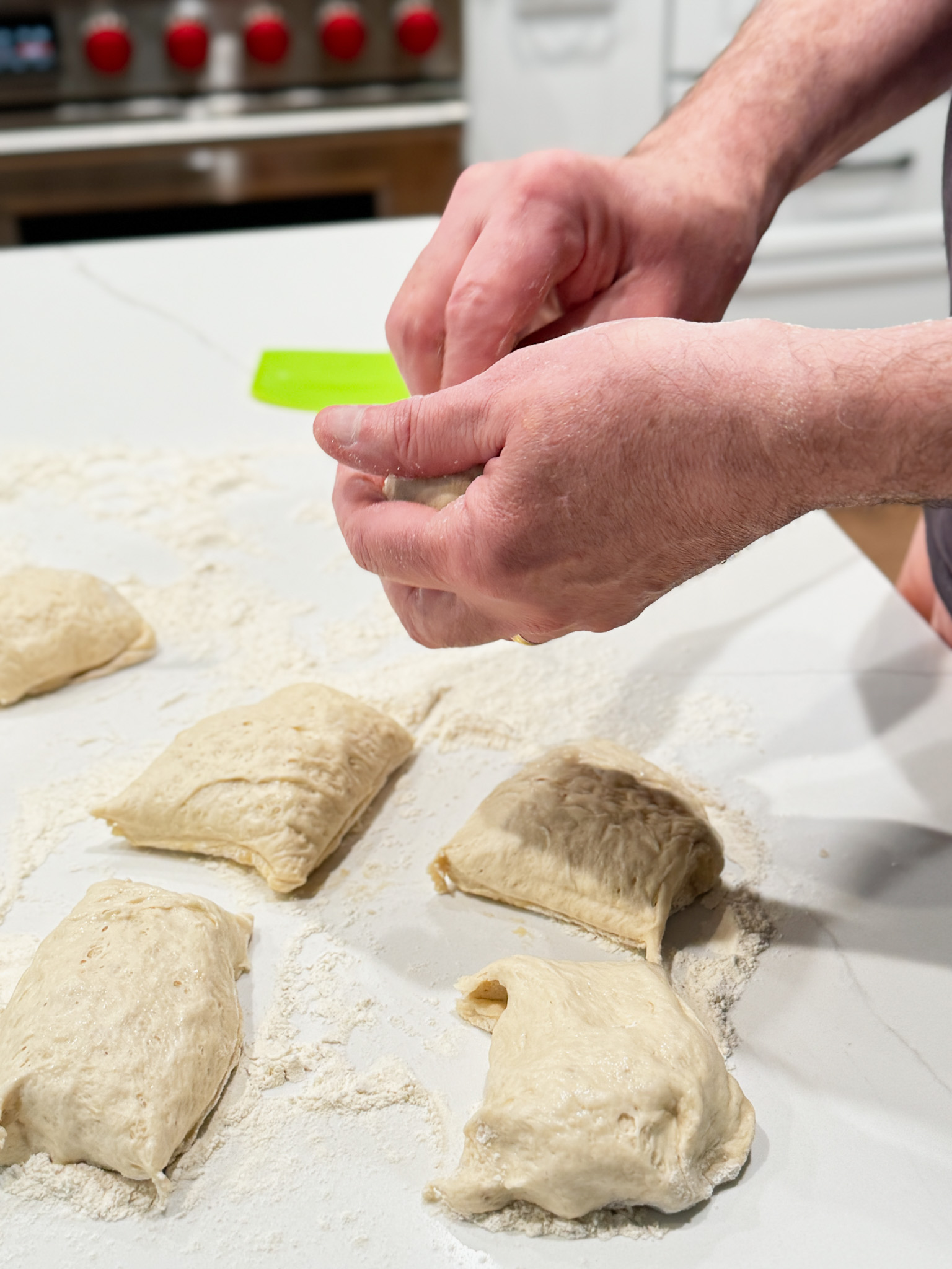 Hands forming bagels