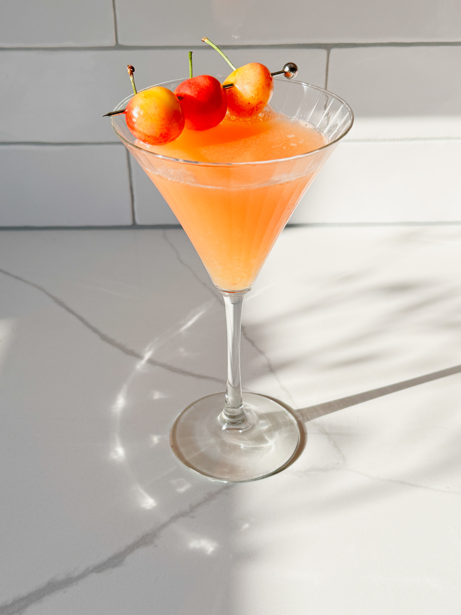 Cherry sea breeze martini with Ranier cherry garnish