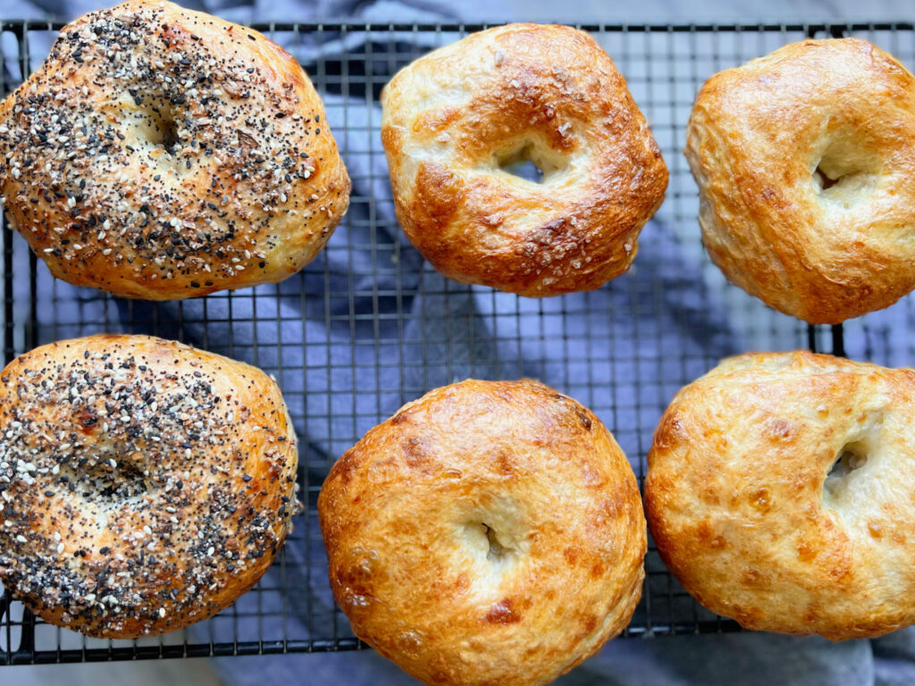 bagels on a cooling rack with a blue napkin